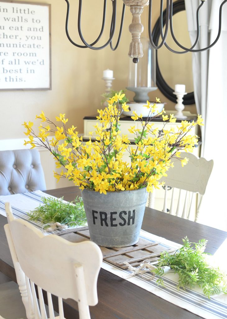 DIY Bucket of Flowers Centerpiece. Beautiful farmhouse centerpiece for spring