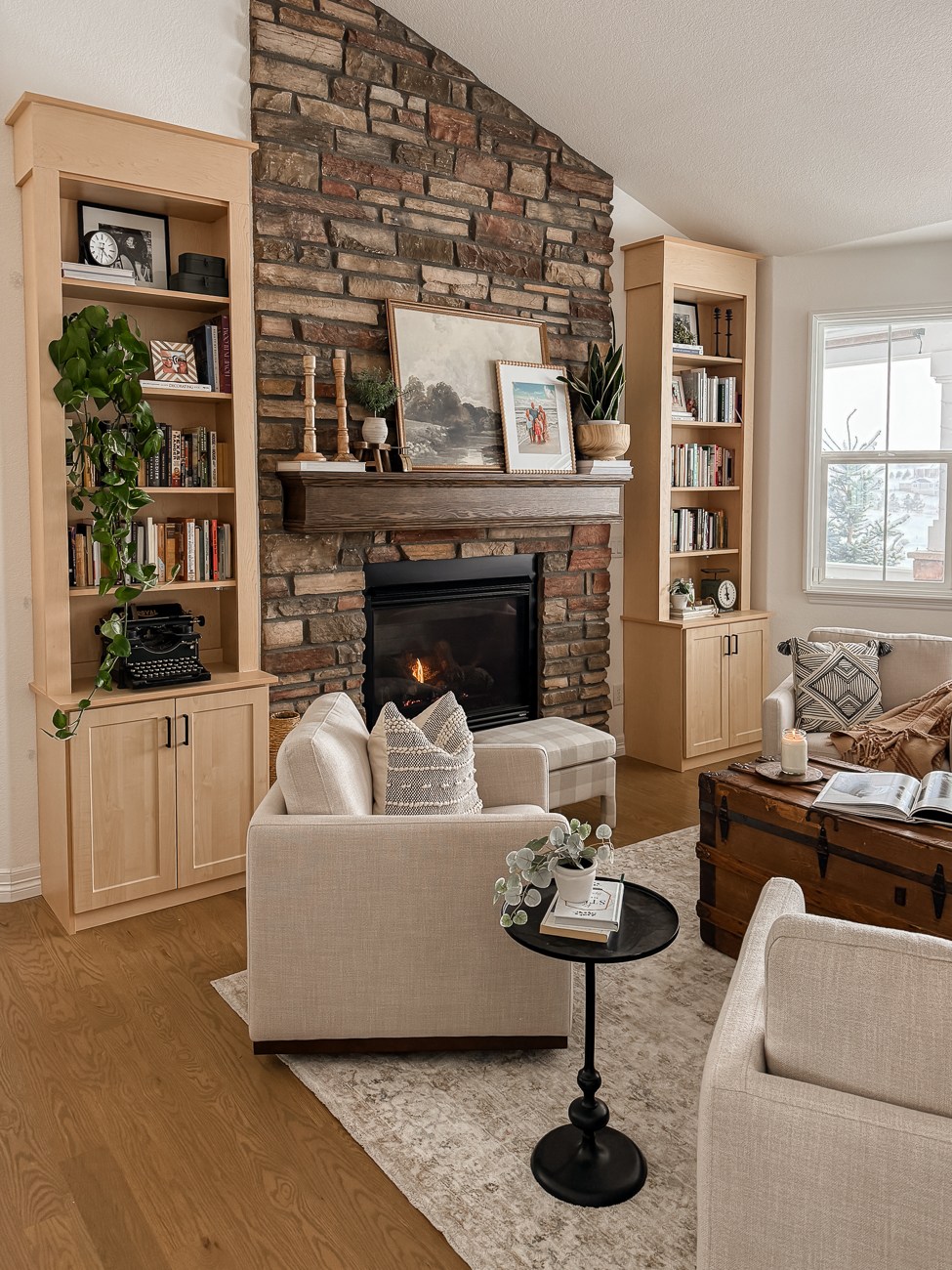 Bookshelves in the Front Room! Cozy sitting room with bookshelves on either side of fireplace.
