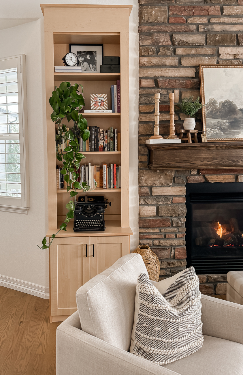 Bookshelves in the Front Room! Cozy sitting room with bookshelves on either side of fireplace.
